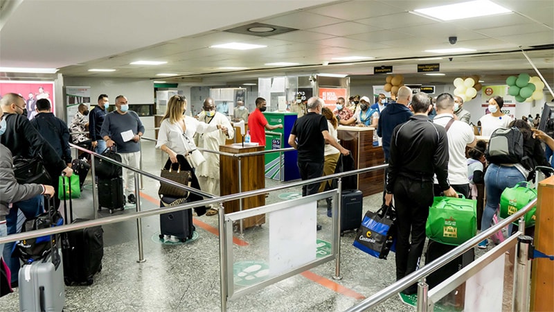 Travelers waiting in line at airport