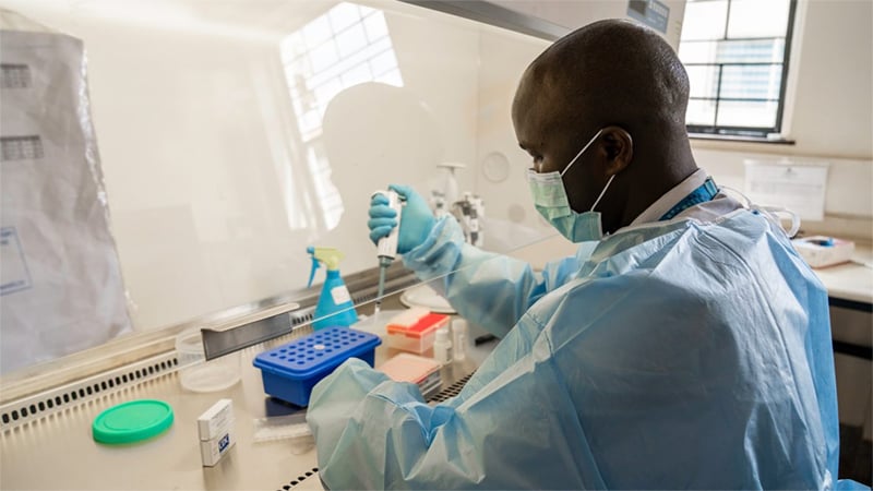 man testing samples in a lab