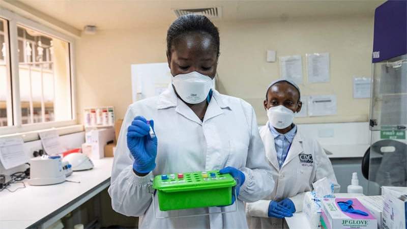 two women in a Kenya lab processing COVID-19 tests