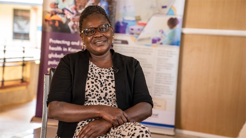 photo of a woman sitting and smiling