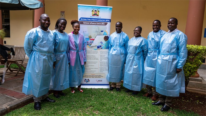 photo of a group of people outside a laboratory