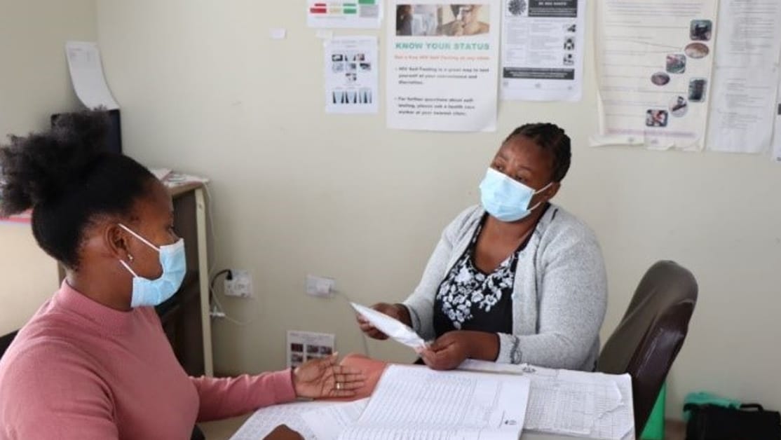 Health counselor talks to a patient about HIV self-testing.