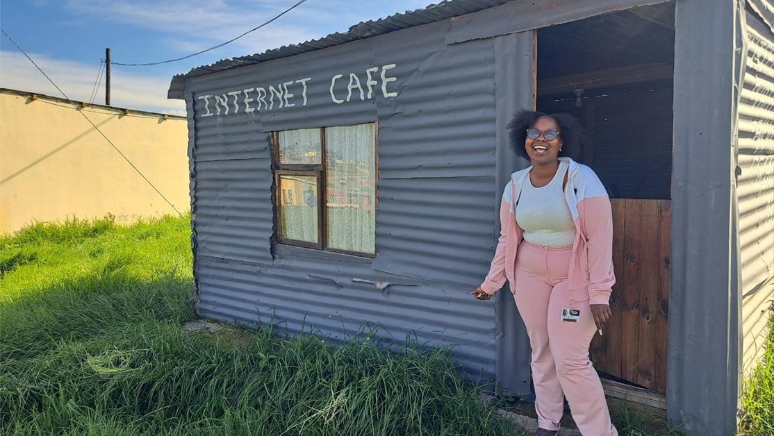 Woman standing outside of building