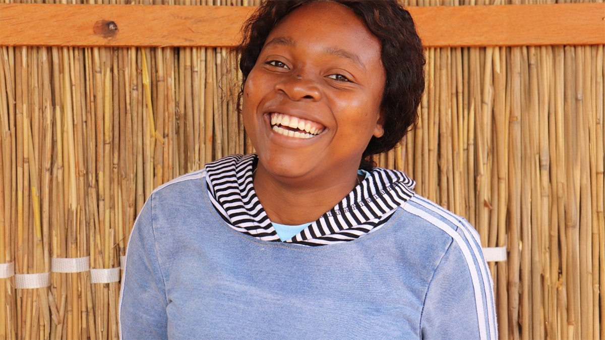 Portrait of a young woman smiling in Mozambique.