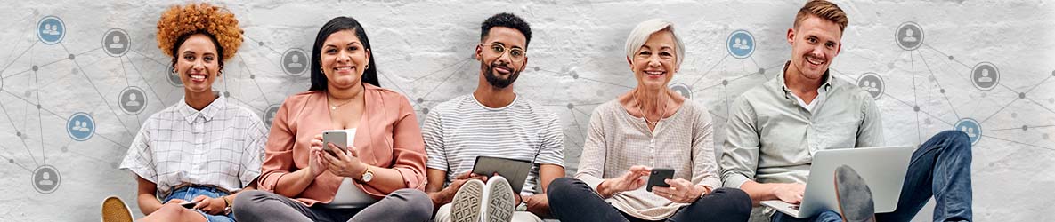 Group of diverse individuals using ipads, phones, and laptops.