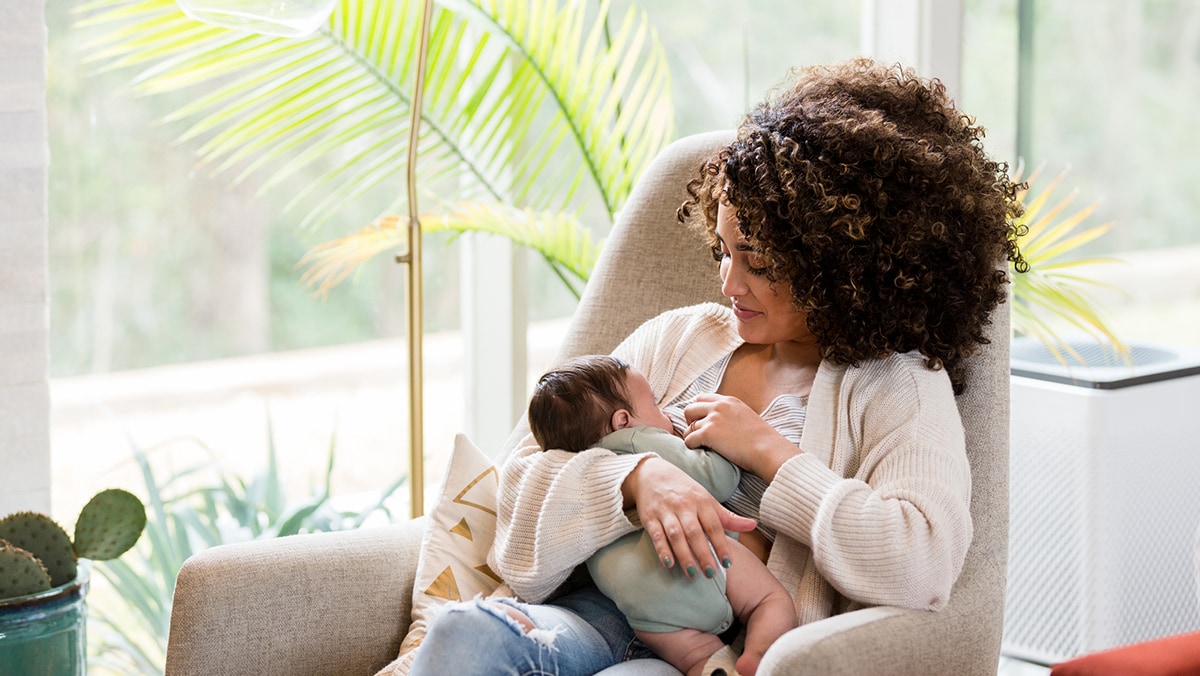 Mother breastfeeding her child.