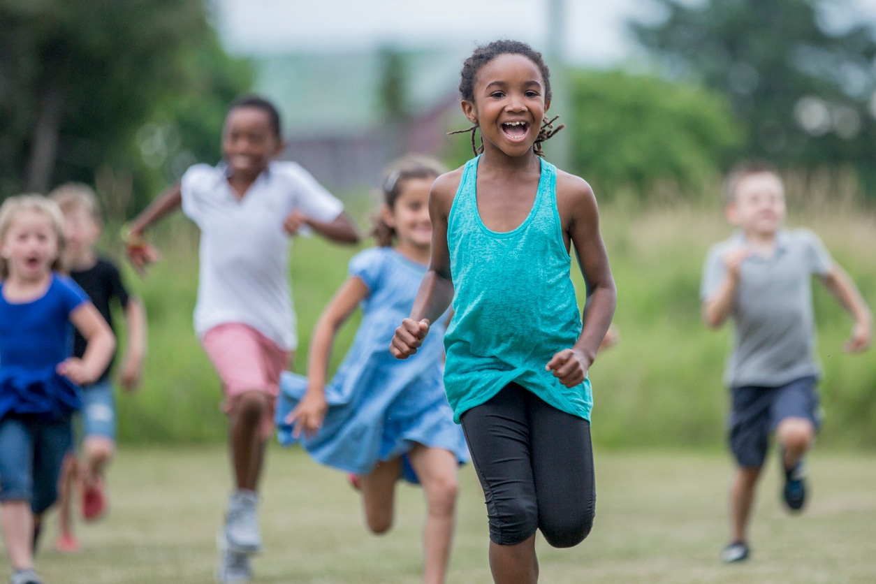 Children running a park after school.