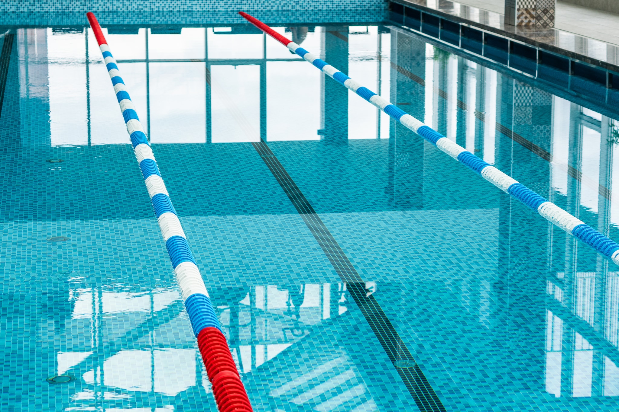 Close up of a pool lane at an indoor pool.