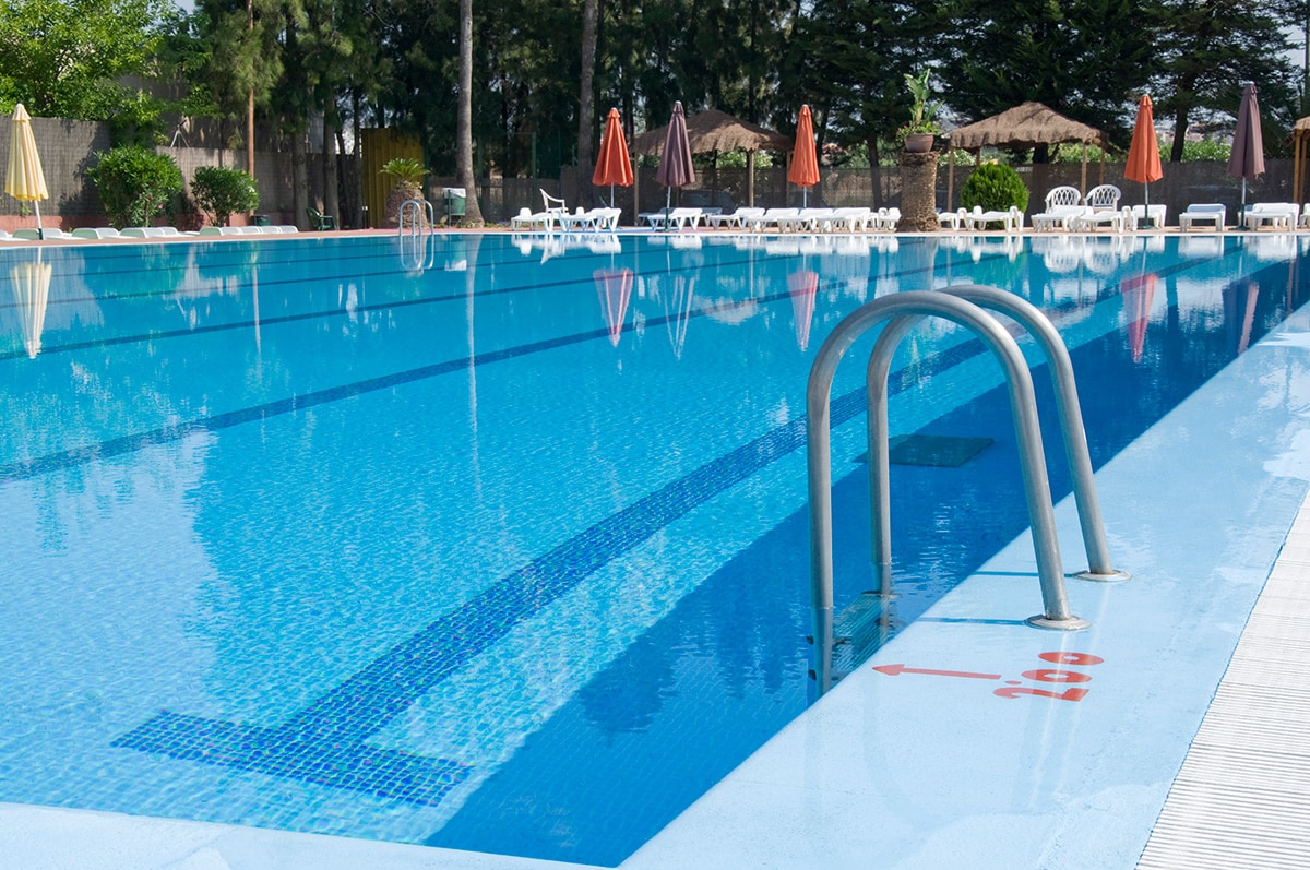 An empty, outdoor swimming pool.