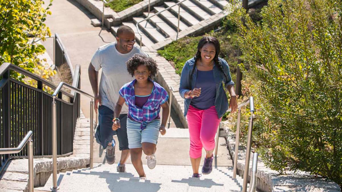 A family walking up stairs