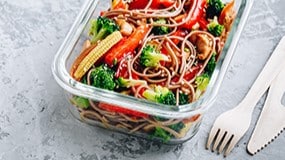 Bowl with colorful vegetables such as broccoli, carrots, and red peppers.