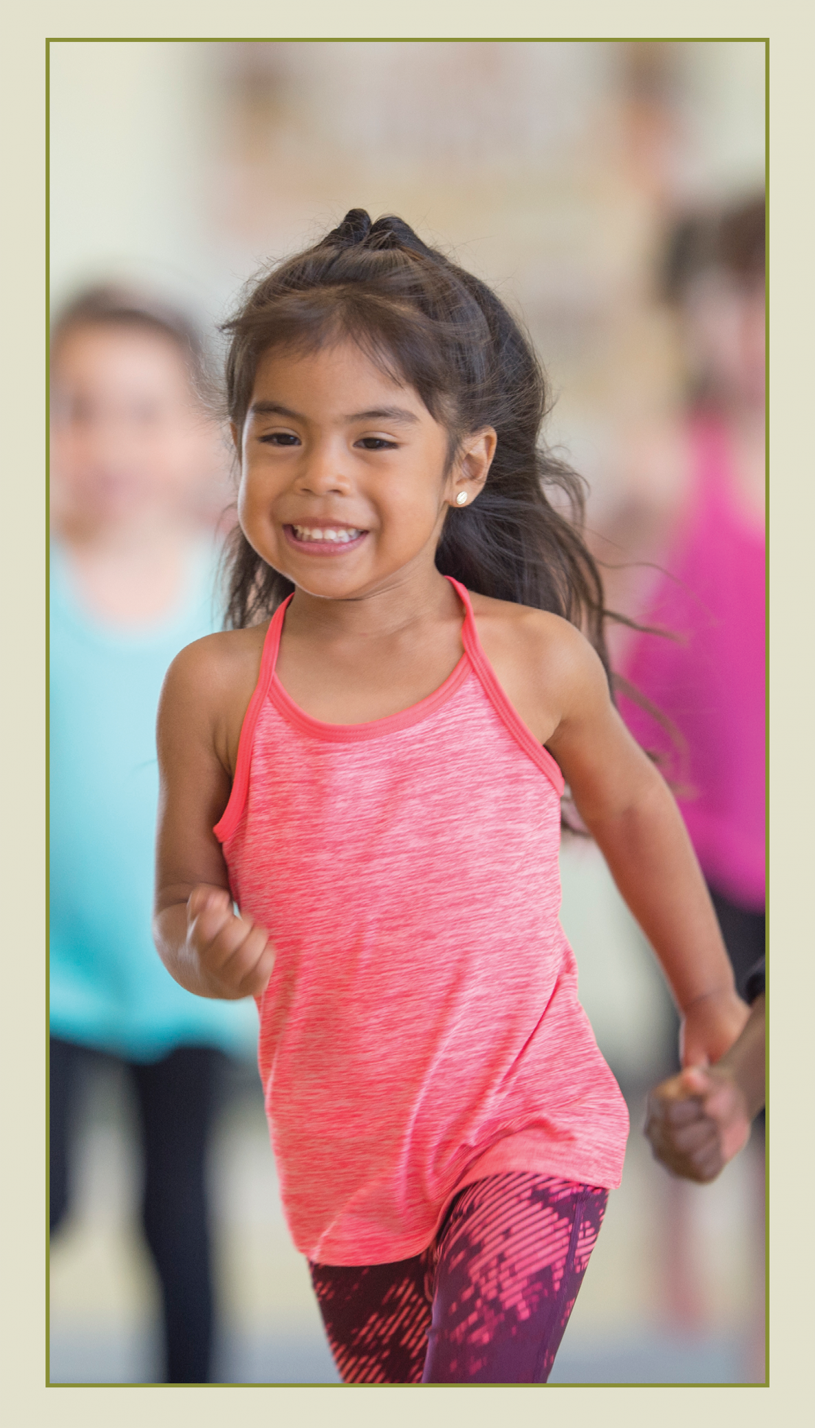 A smiling, little girl running.