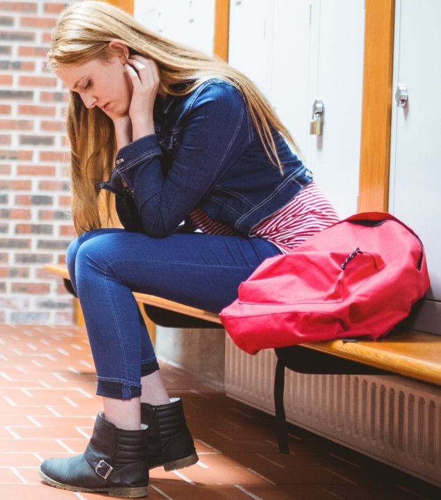 a female student sitting on the bench