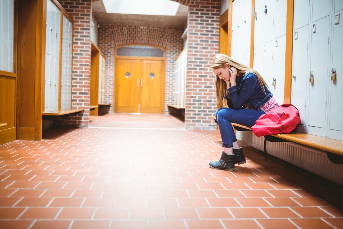 A teen in a locker room