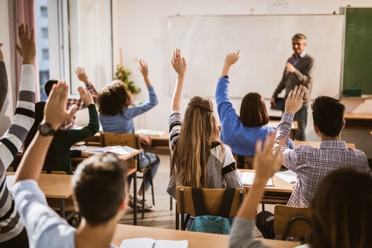 Classroom image with a teacher and students