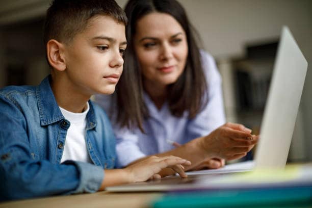 Mother and son talking over the laptop