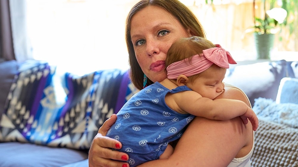 woman holding baby