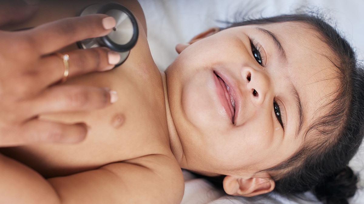 Doctor listening to baby's heart