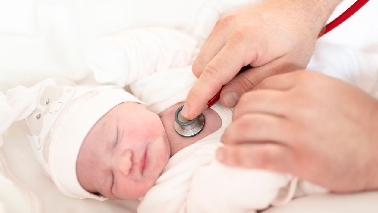 Doctor listening to a baby's heart