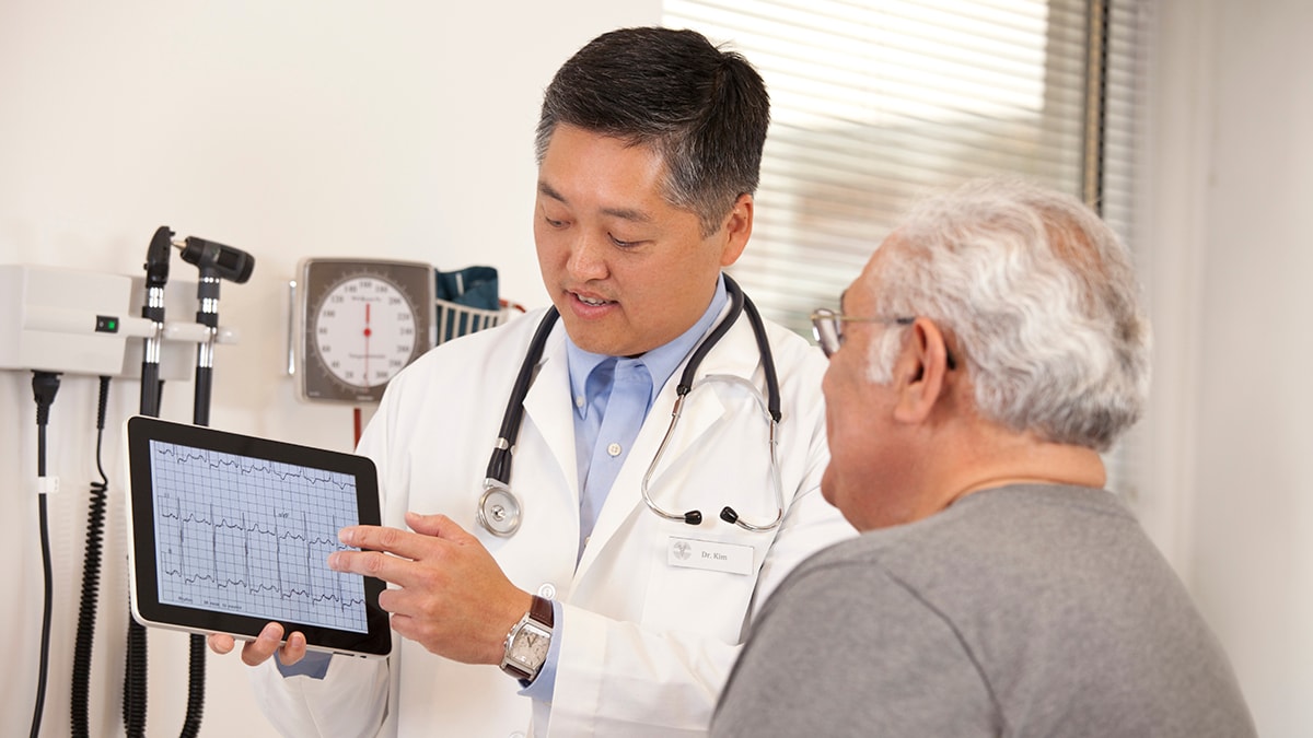 A pharmacist talking with a customer about his medication.