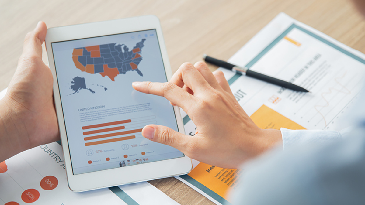 Healthcare professional reviewing map data for IVHSP hepatitis funding