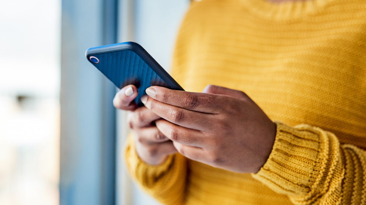 A person reviews viral hepatitis social media assets from their phone