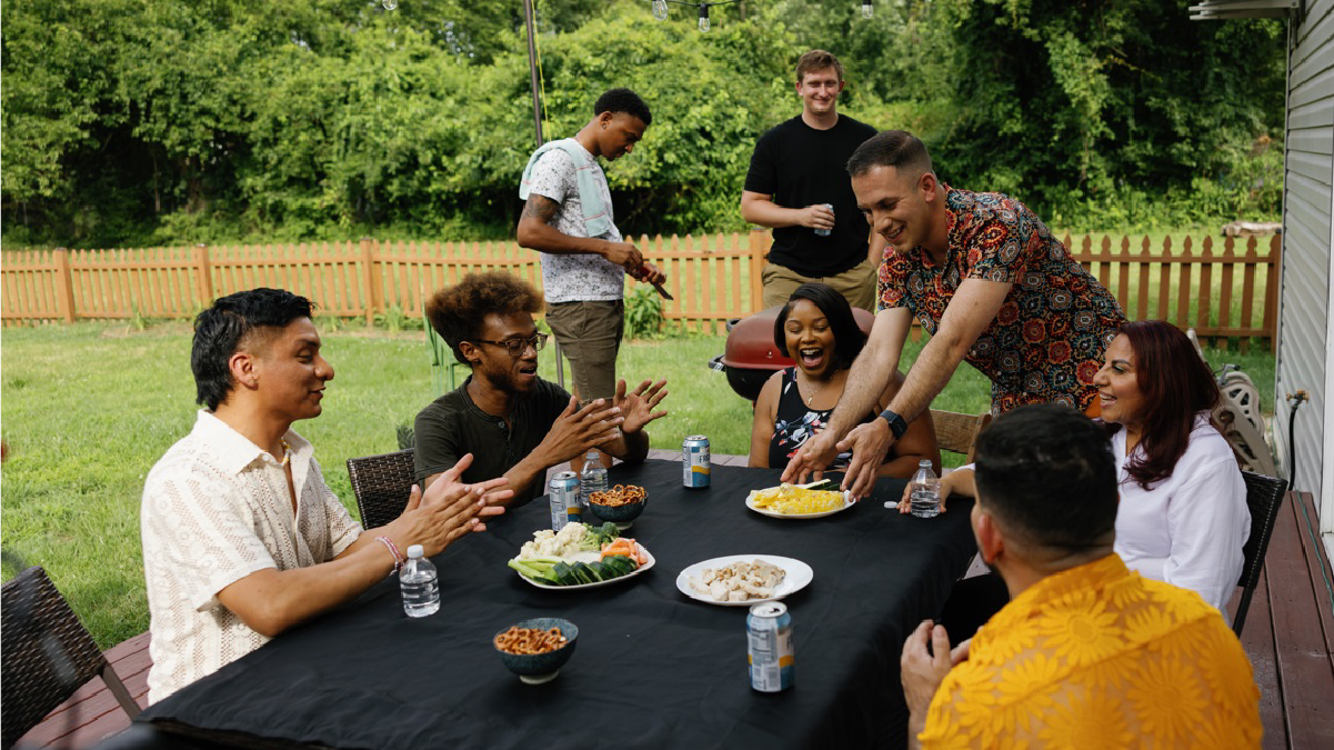 People at a table socializing.