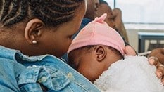 Image of a mother breastfeeding an infant.