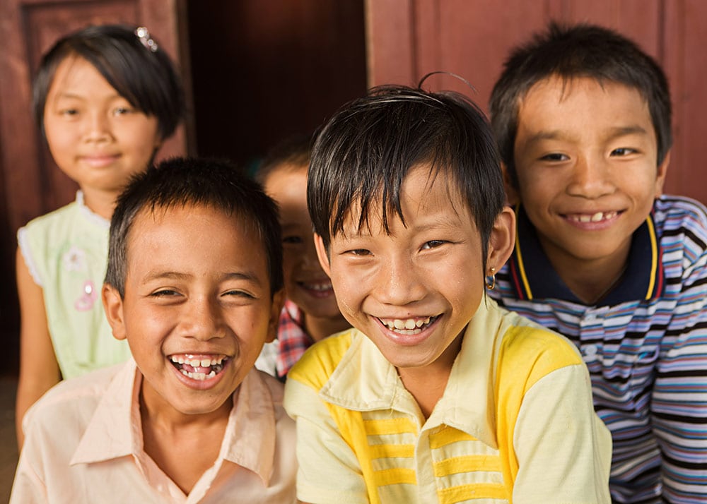 Four smiling children