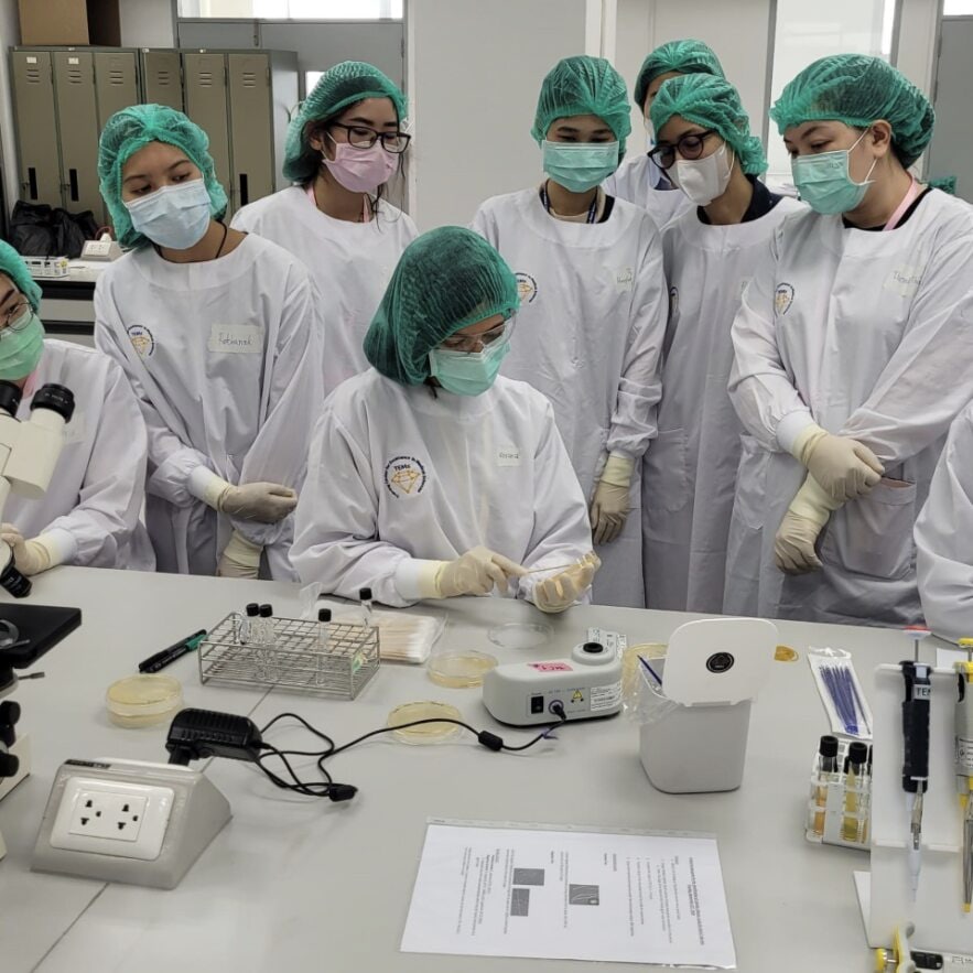 LLS fellow Roxana Rodriguez Stewart, PhD (seated), trains lab staff at training center in Thailand.