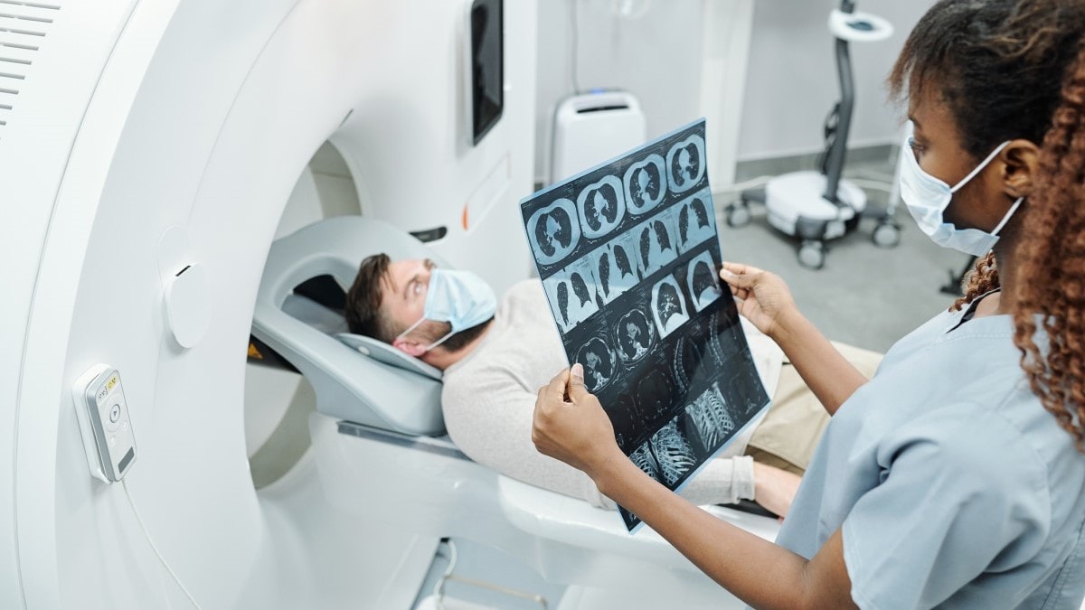 Photo of a man receiving a CT scan