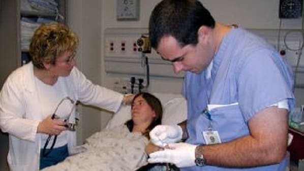 Clinician testing a patient for malaria