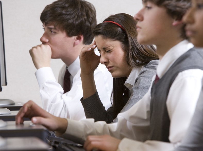 Students in a classroom and one is not feeling well.