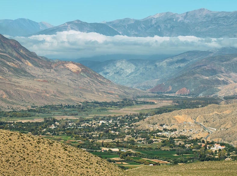 A small town surrounded by mountains.