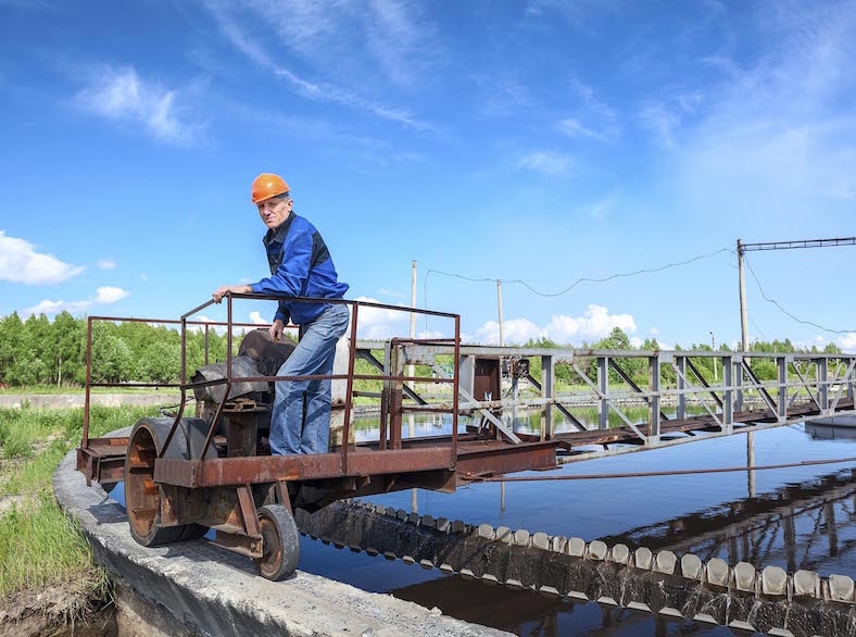 Engineer checking water in a local water treatment plant.