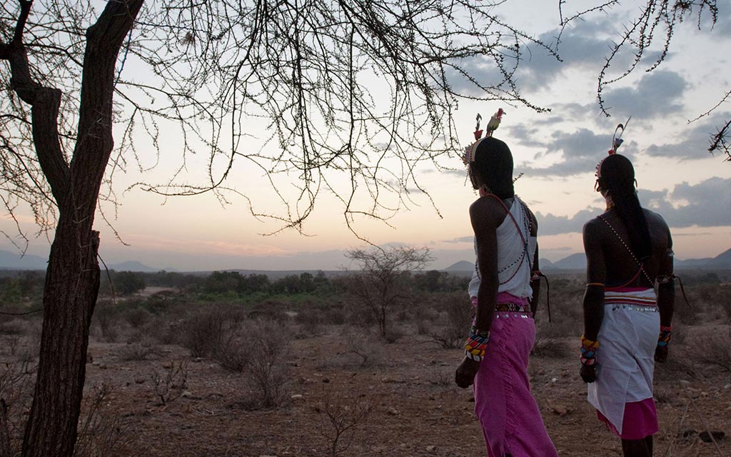 Two village herdsman walking.