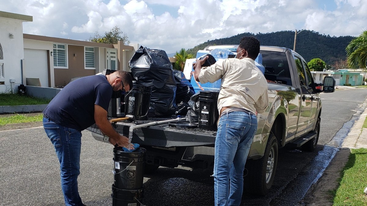 Mosquito control technicians deploying AGO traps