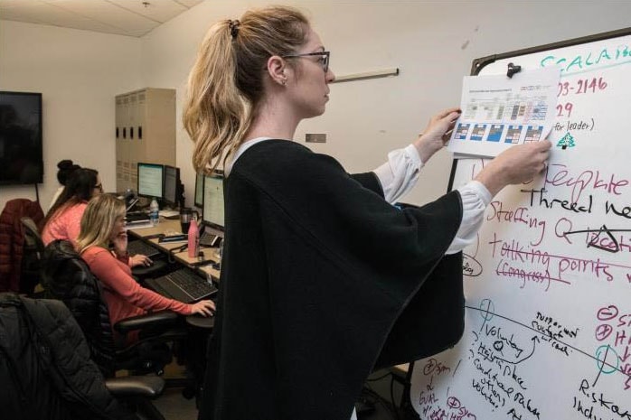 Woman at a whiteboard