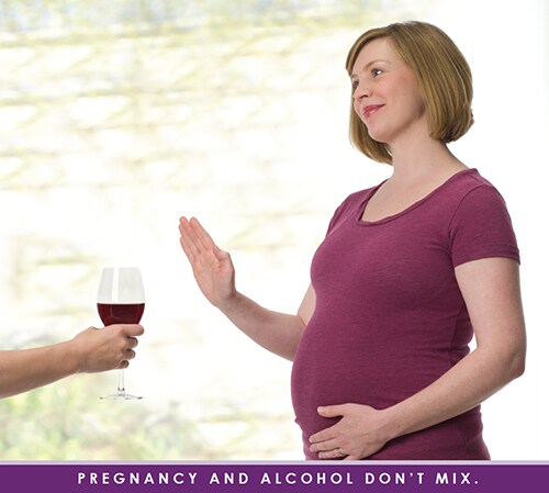 Pregnant woman refusing wine