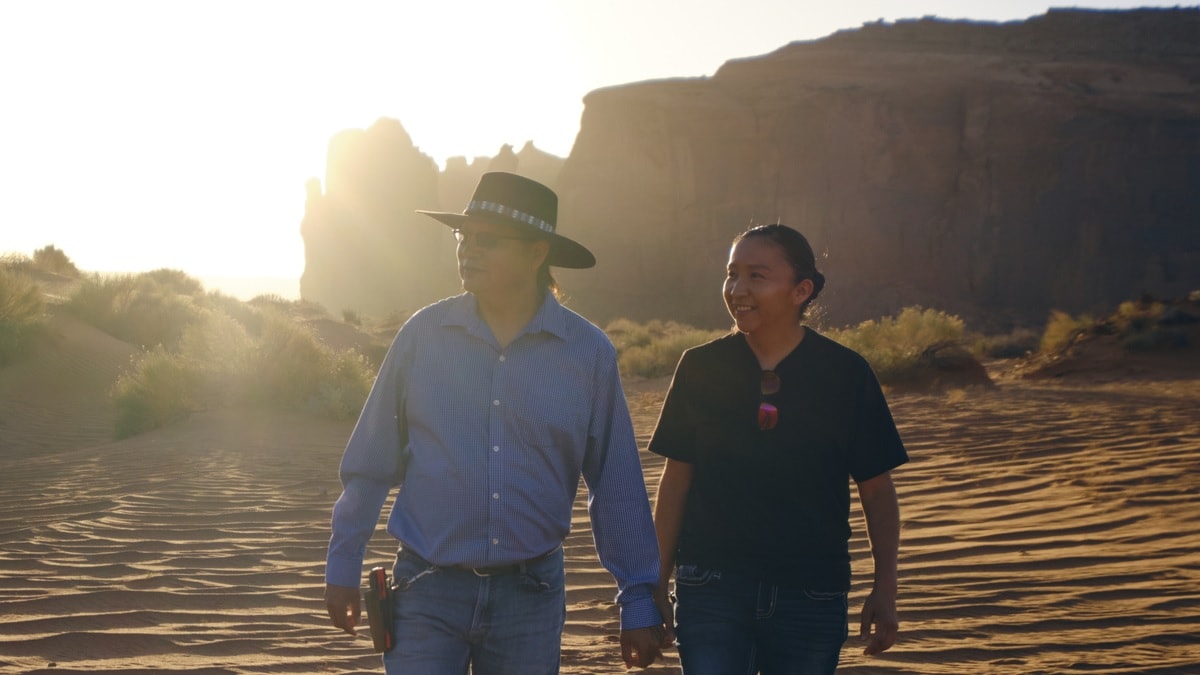 A Native American Navajo couple in the desert at Monument Valley USA.