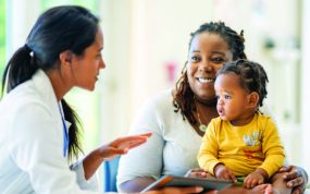 mother with baby and doctor