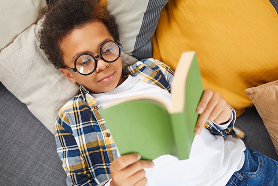 Boy reading green book