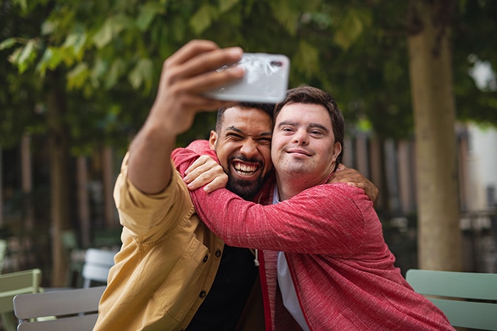 Young man with Down syndrome and his mentor