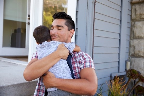 Father holding son