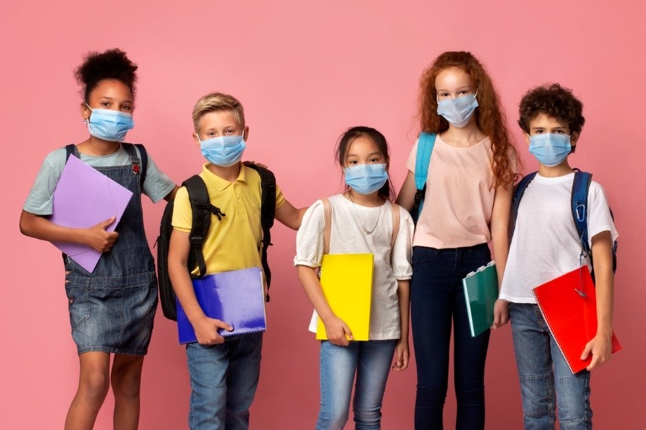 School age children wearing protective face masks