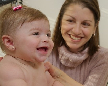 A happy baby with her mother