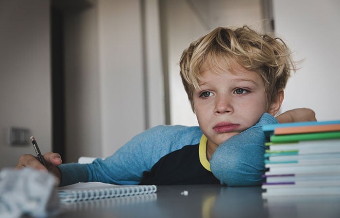 A child frustrated with his schoolwork