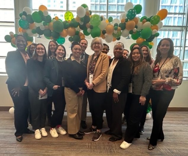 EHDI staff from DHDD and HRSA standing in front of balloons