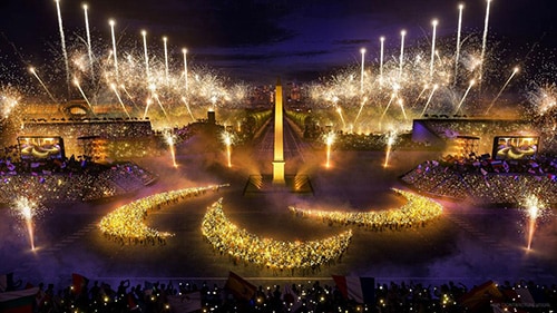 Opening Ceremony of the 2024 Paralympic Games showing the lit torch, fireworks, and a lighted logo of the International Paralympic Committee