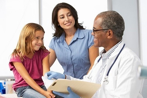 A mother and daughter visit the doctor